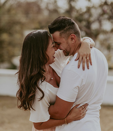 Couple hugging and smiling, represents how couples counseling in Montclair, NJ can help strengthen your relationship.