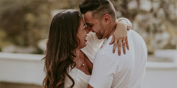 Couple hugging and smiling, represents how you can find support to grow your relationship through couples therapy in Montclair, NJ.