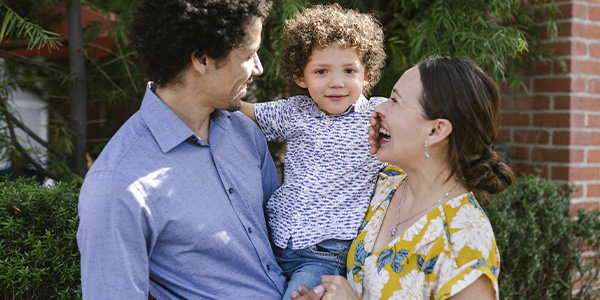 Happy immigrant family reunited, represents how we provide immigration evaluations to support family cohesion and legal proceedings.